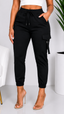 Black cargo jogger pants worn by a person on a white background
