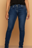 Blue jeans worn by a person on a white background